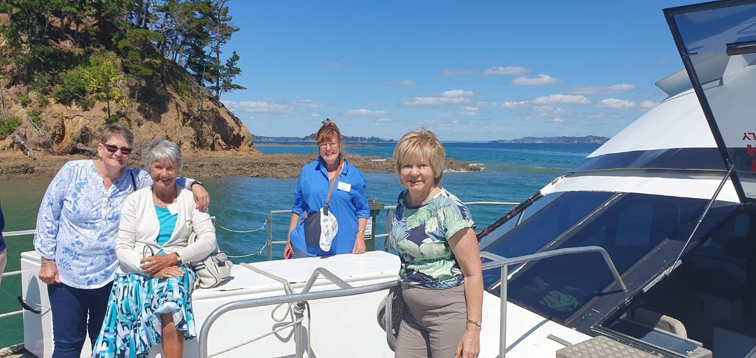Guests enjoying a sunny day by the water